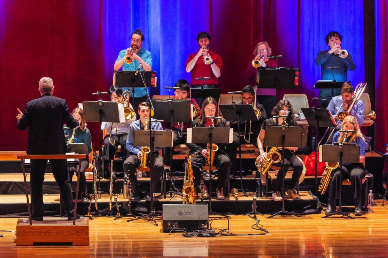 Students playing instruments on the stage 